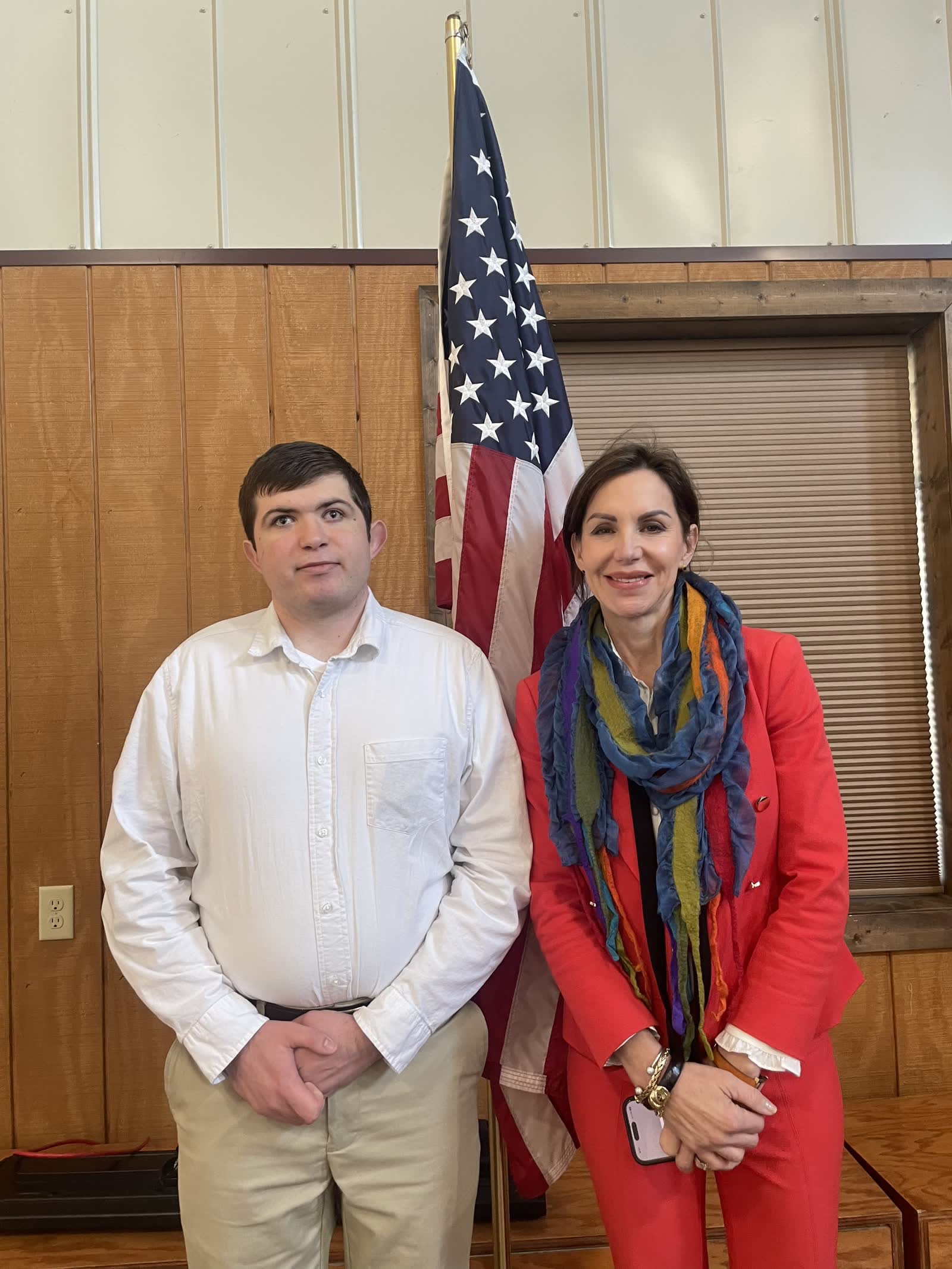 Lucas Cook standing in a patriotic public setting