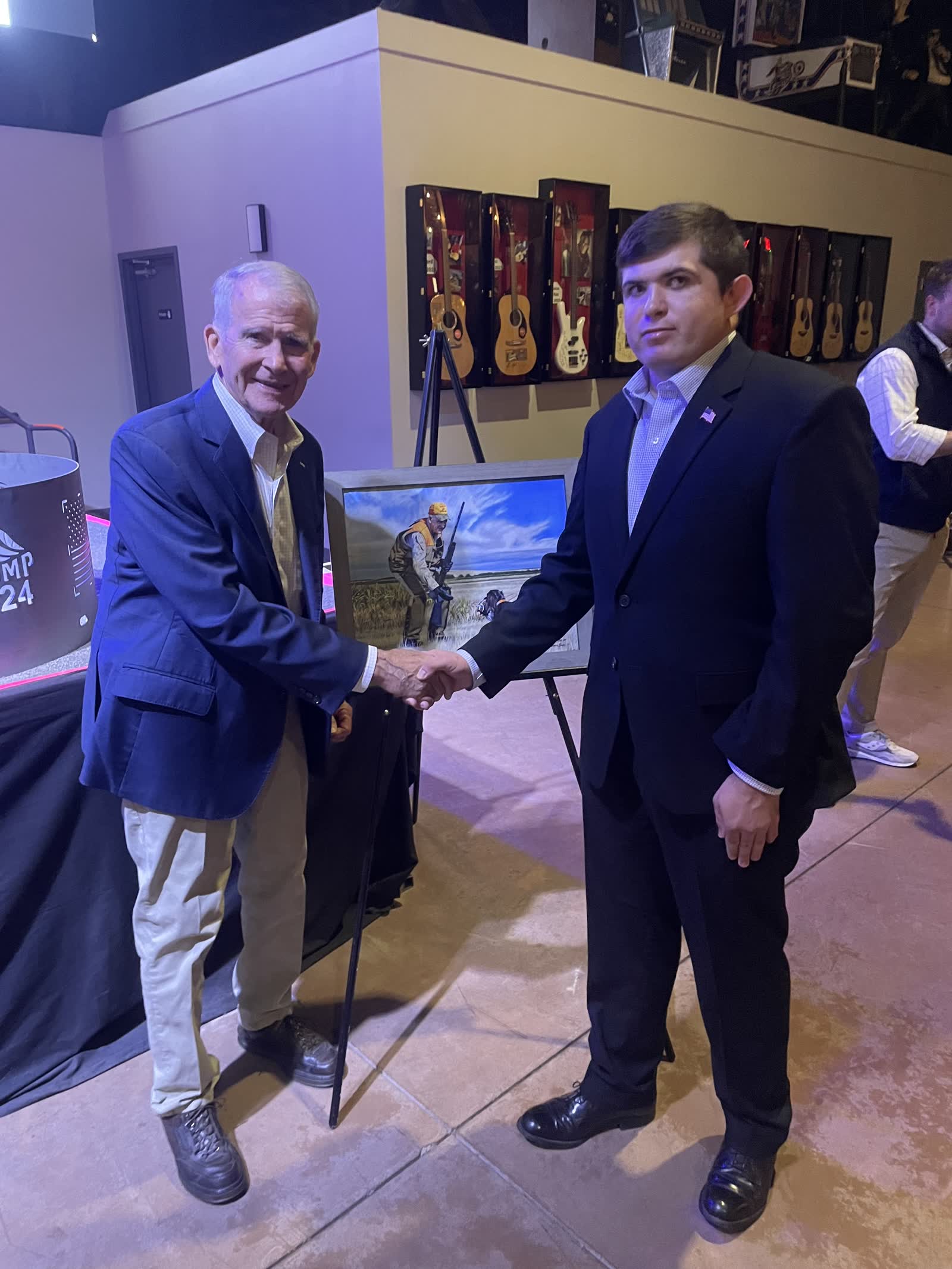 Lucas Cook shaking hands at a public event